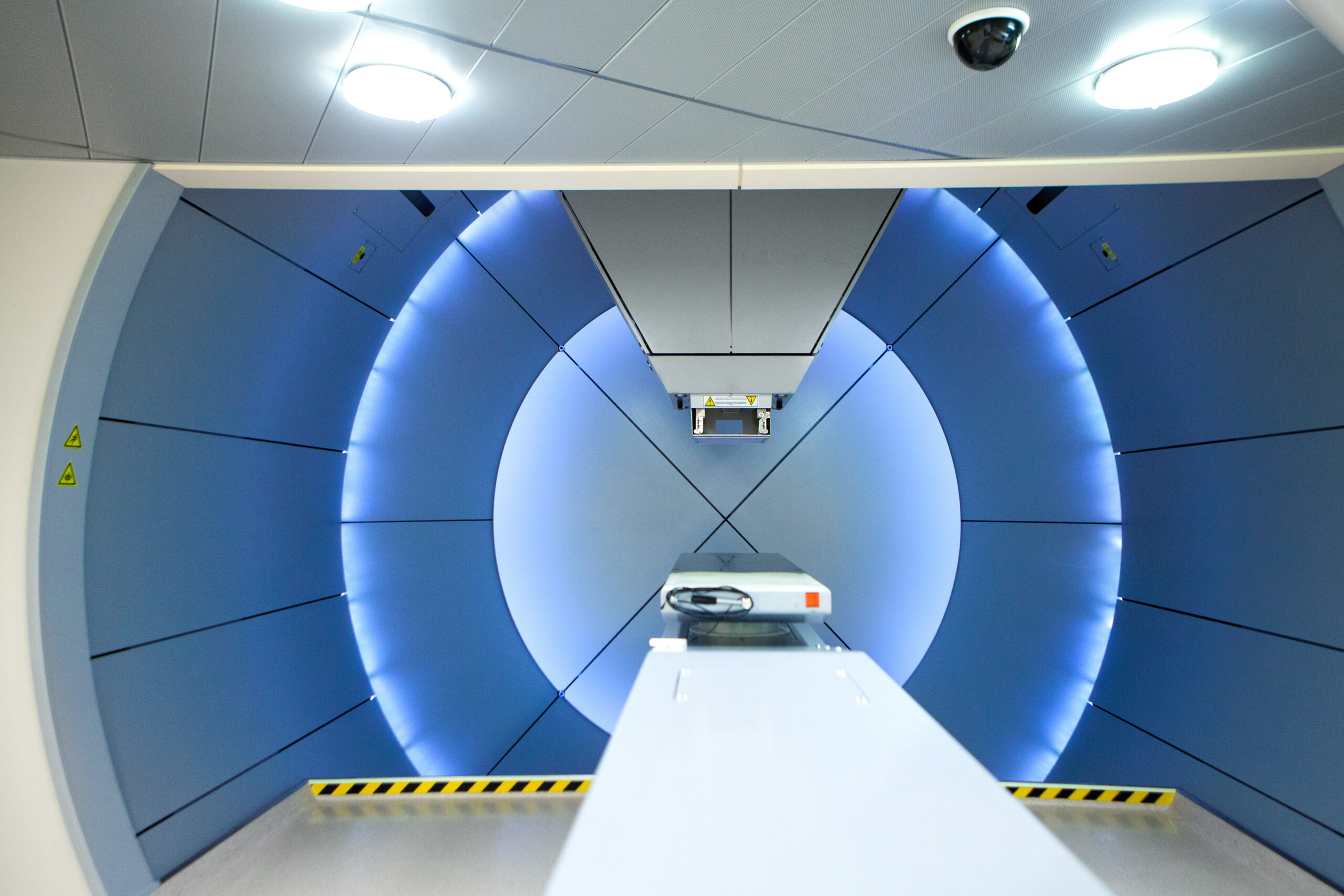Proton therapy irradiates cancer cells with a beam of protons inside the tumor.